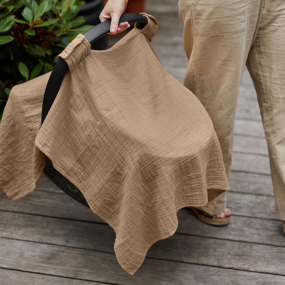 Huxie car-seat cover on stroller ready for versatile coverage.