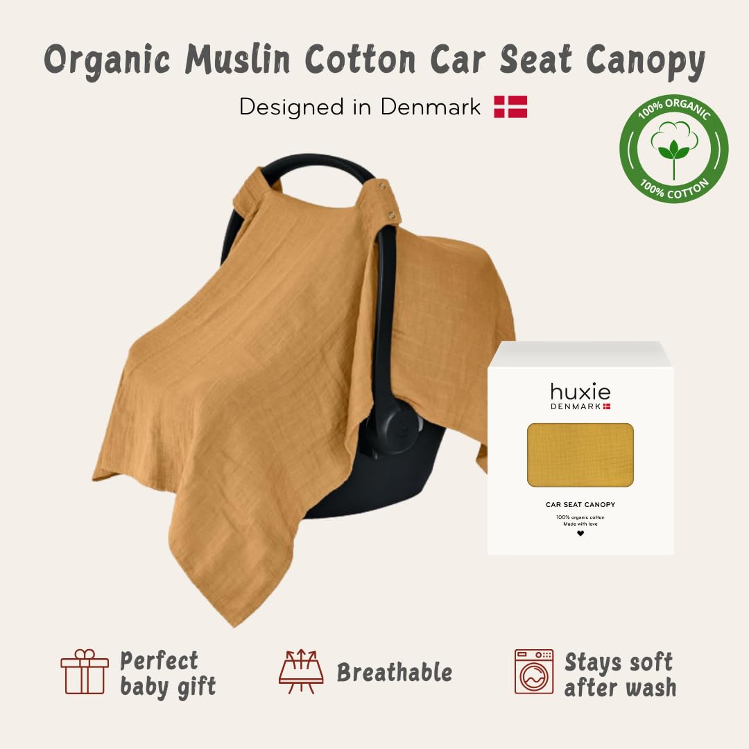 Huxie Denmark car seat canopy offers privacy while on the go in soft organic muslin.