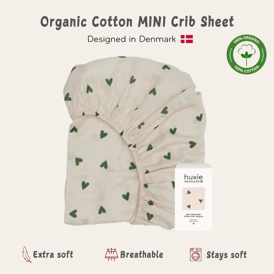 Huxie fitted mini-crib-sheet deep pockets show secure elastic edge.
