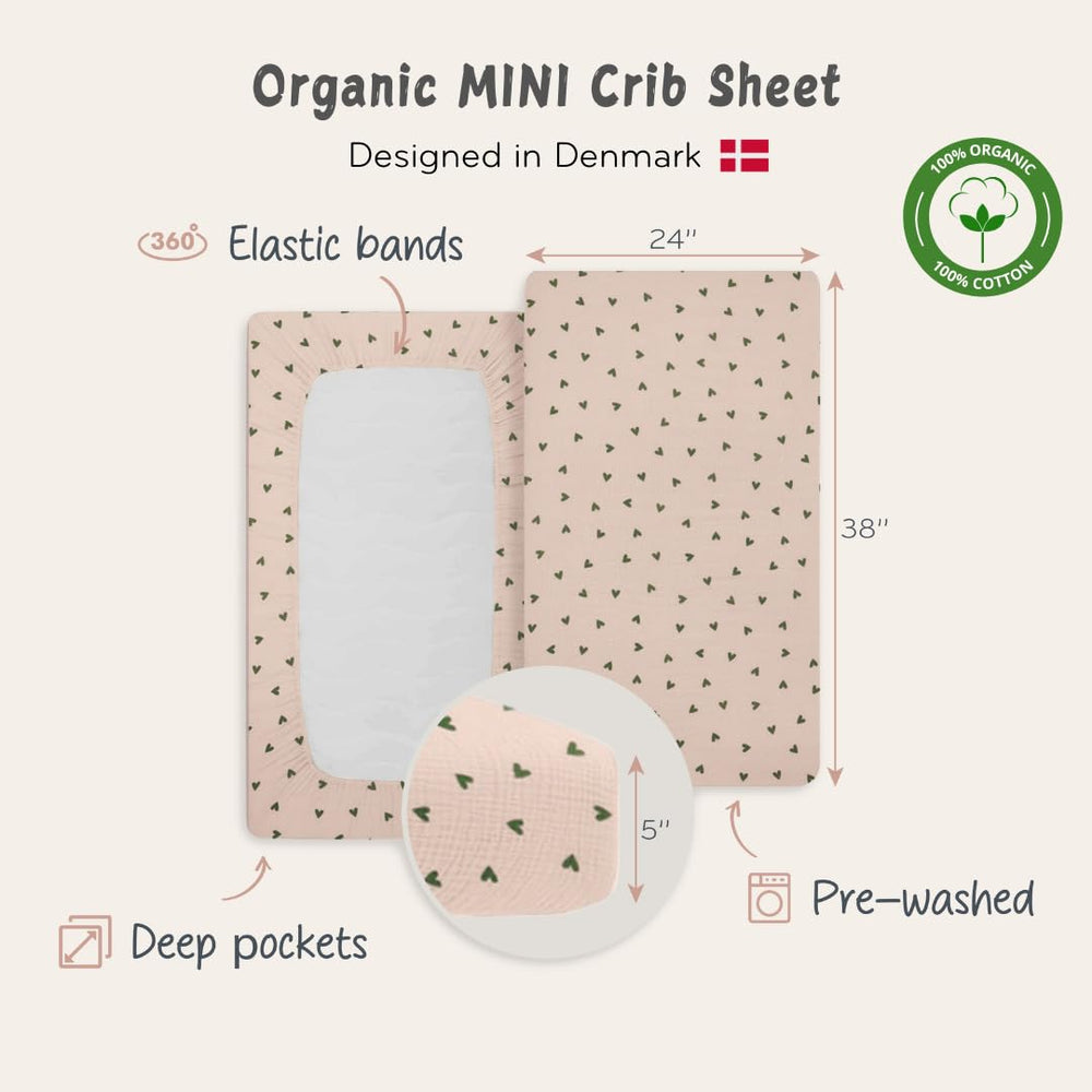 Huxie green hearts design on sheet emphasizes gender-neutral calming aesthetic.