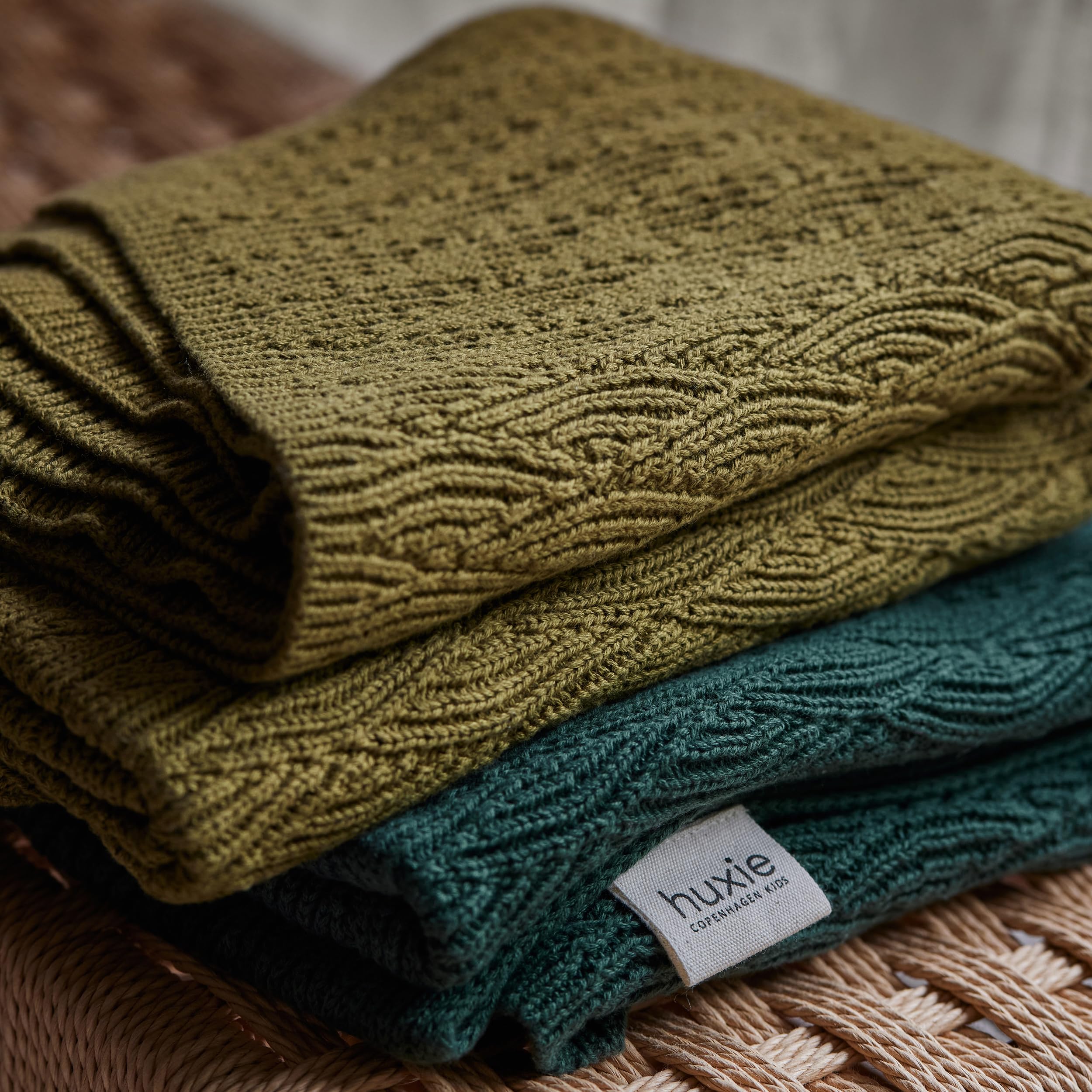 Huxie Knitted Baby Blanket used as car-seat cover for travel
