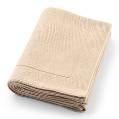 Huxie knitted baby blanket Fog close-up reveals soft organic cotton texture.