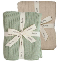 Huxie knitted baby blanket Fog colorway offers cozy organic warmth for sensitive skin.