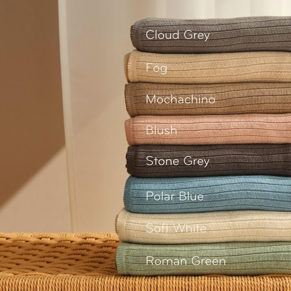 Huxie knitted baby blanket fog newborn-cozy shot emphasizes breathable warmth.