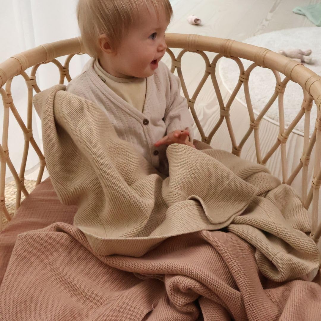Huxie Fog blanket on cozy nursery setting emphasizing warmth.