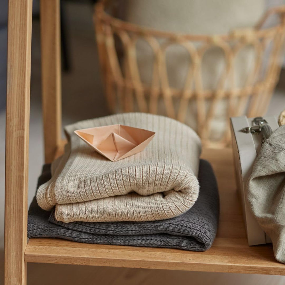 Huxie blanket texture conveys softness and plushness ideal for snuggles.