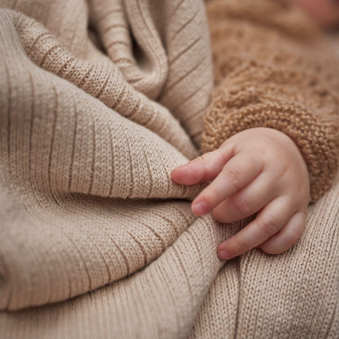 Huxie knitted baby blanket gift-ready packaging signals a timeless baby gift.