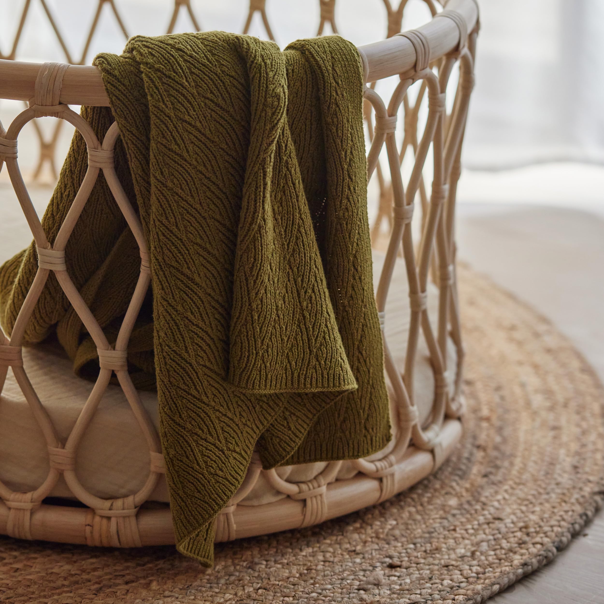 Huxie knitted baby blanket moss green after washing highlighting easy-care durability