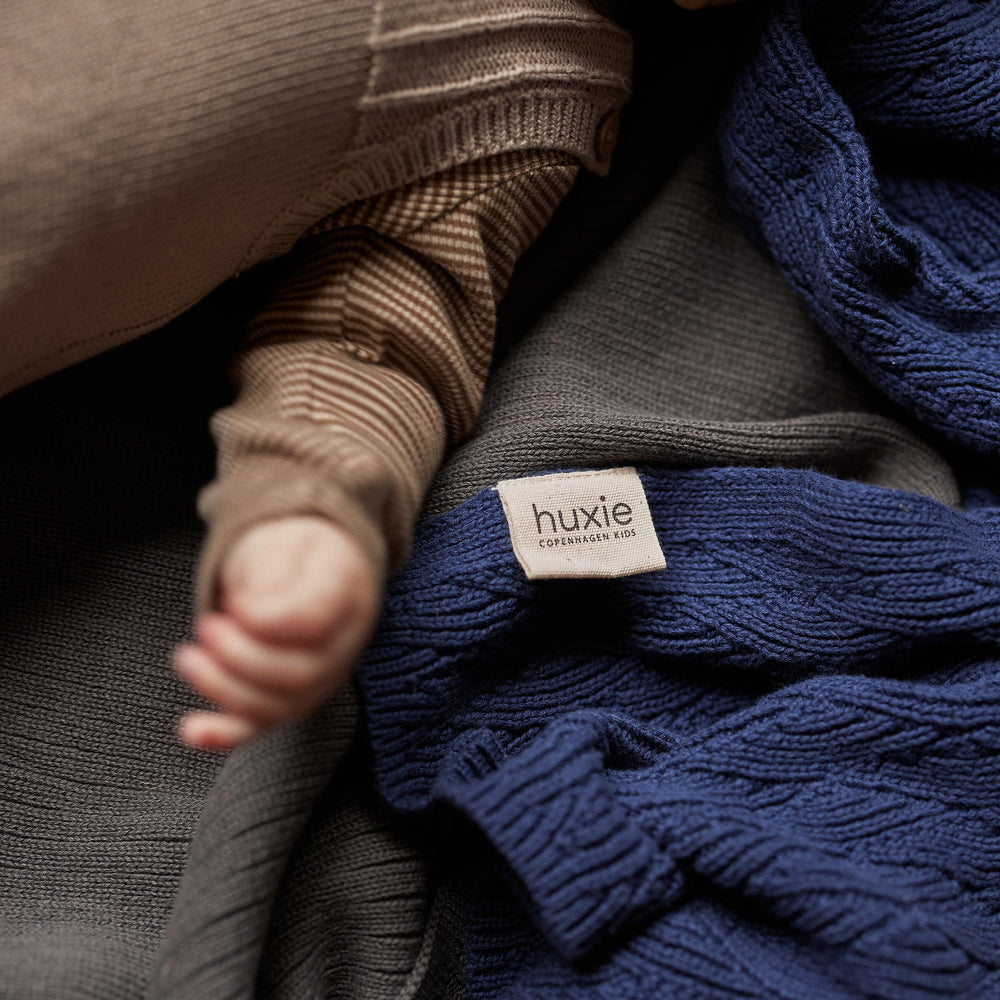 Huxie knitted baby blanket North Sea Blue crib-time companion and comfort
