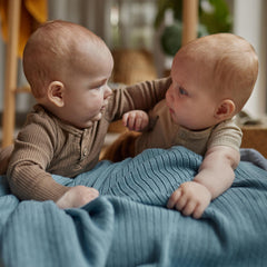 Huxie polar blue ribbed knit close-up showing ultra-soft organic cotton