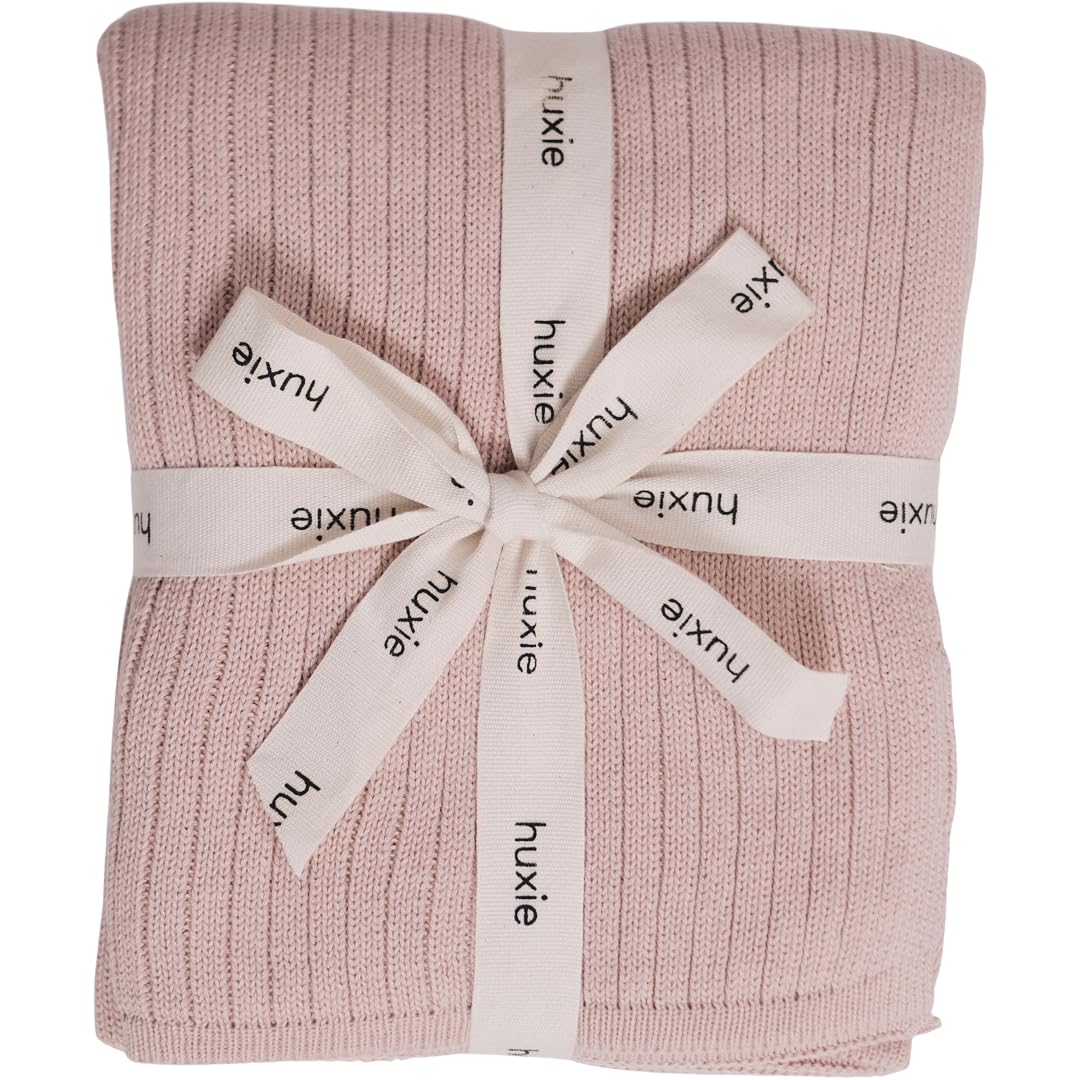 Huxie knitted baby blanket ribbed blush close-up for sensitive skin comfort.