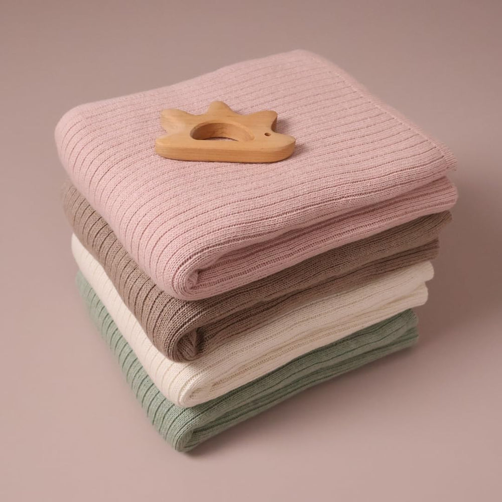 Huxie ribbed knit close-up emphasizes soft organic cotton fibers.