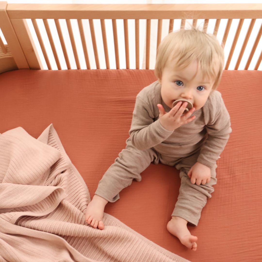 Huxie neutral blush tone complements any nursery decor.