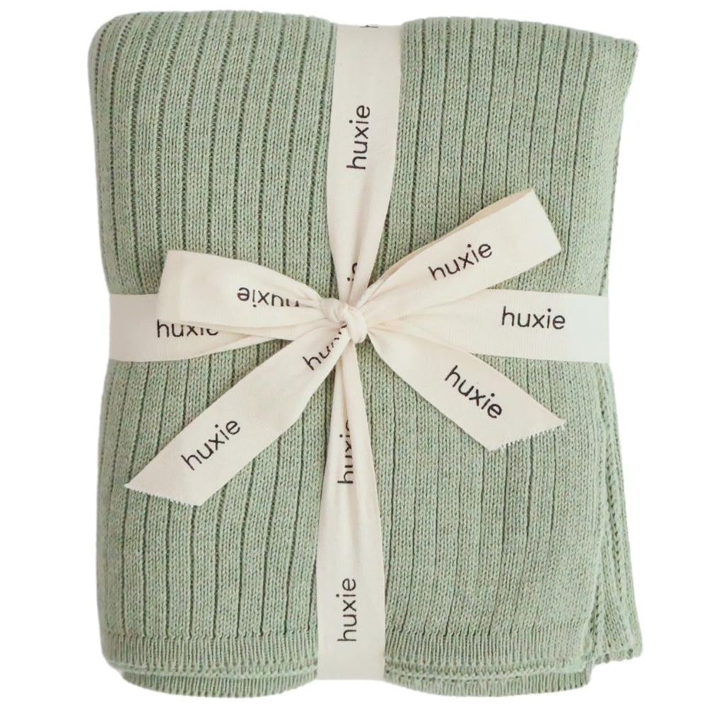 Huxie knitted baby blanket Roman Green folded for cozy snuggles.