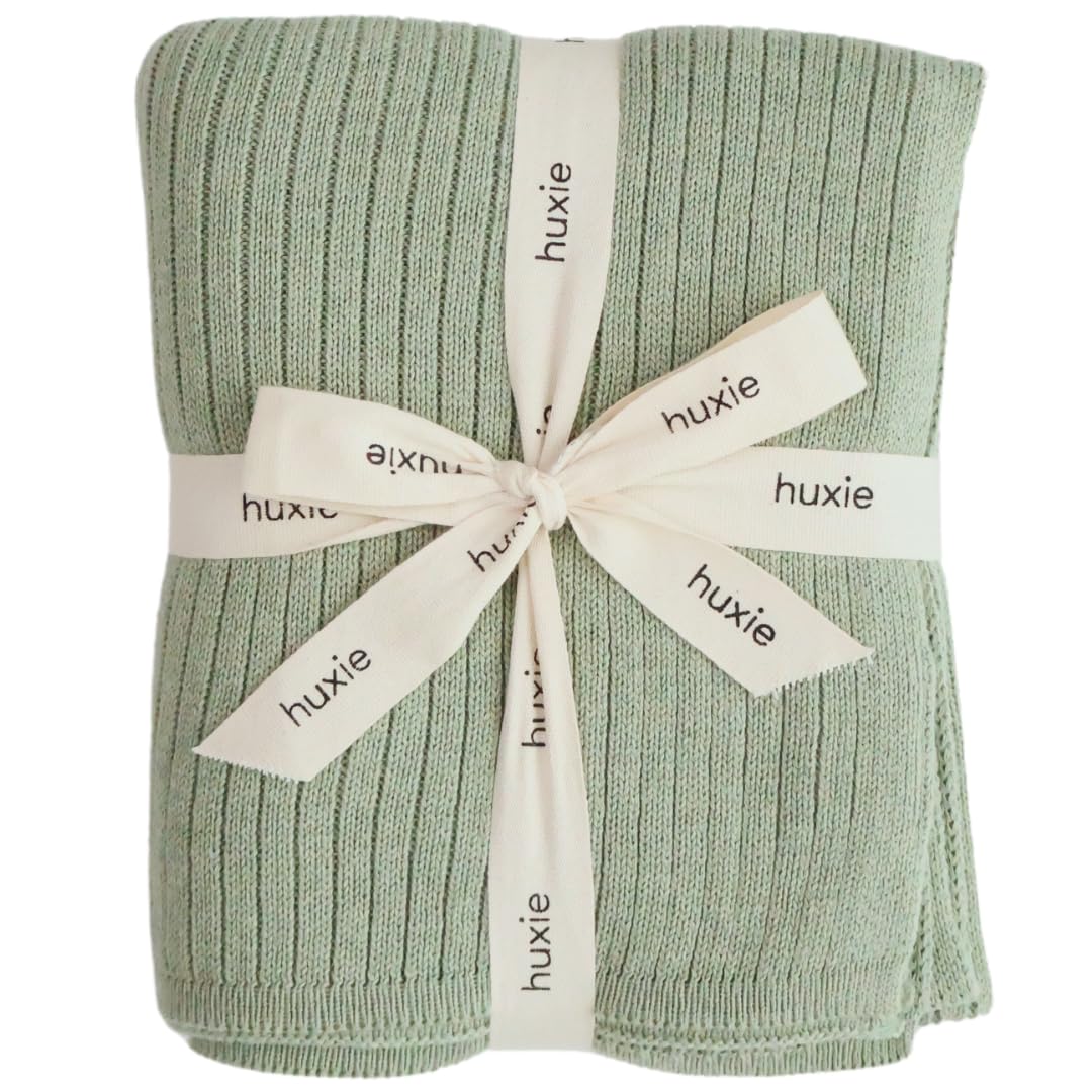 Huxie knitted baby blanket Roman Green folded for cozy snuggles.