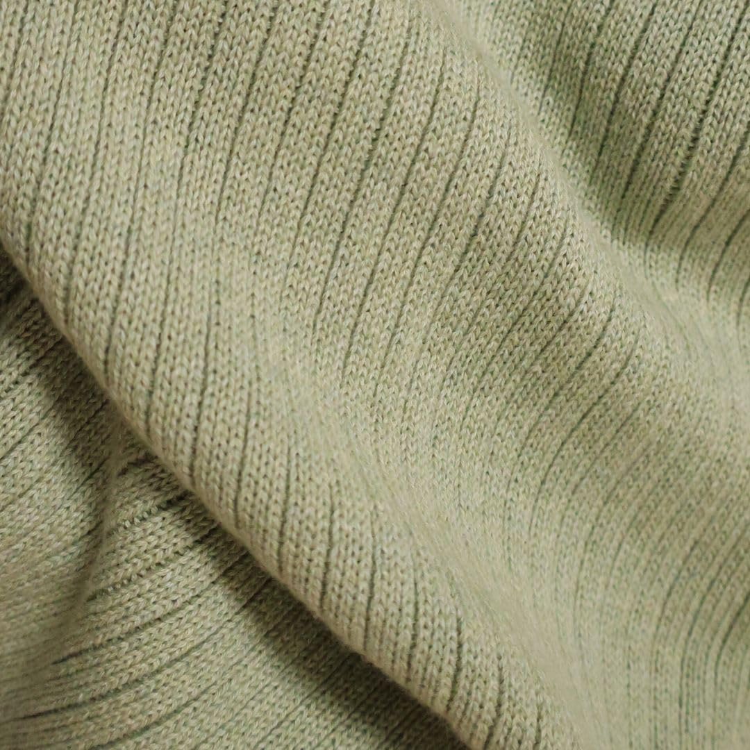 Huxie knitted baby blanket Roman Green care instructions show gentle wash.