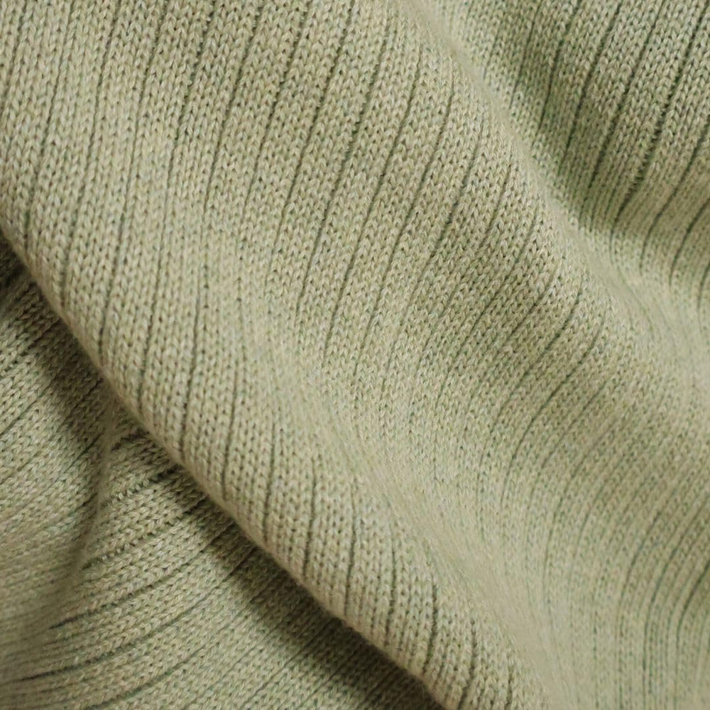 Huxie knitted baby blanket Roman Green care instructions show gentle wash.