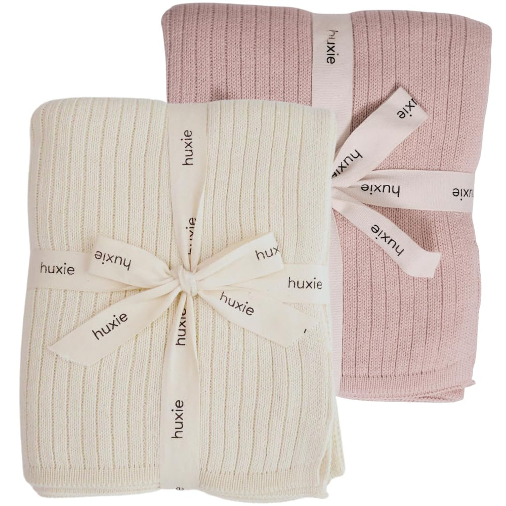 Huxie knitted baby blanket soft white close-up shows ultra-soft organic cotton for sensitive skin.