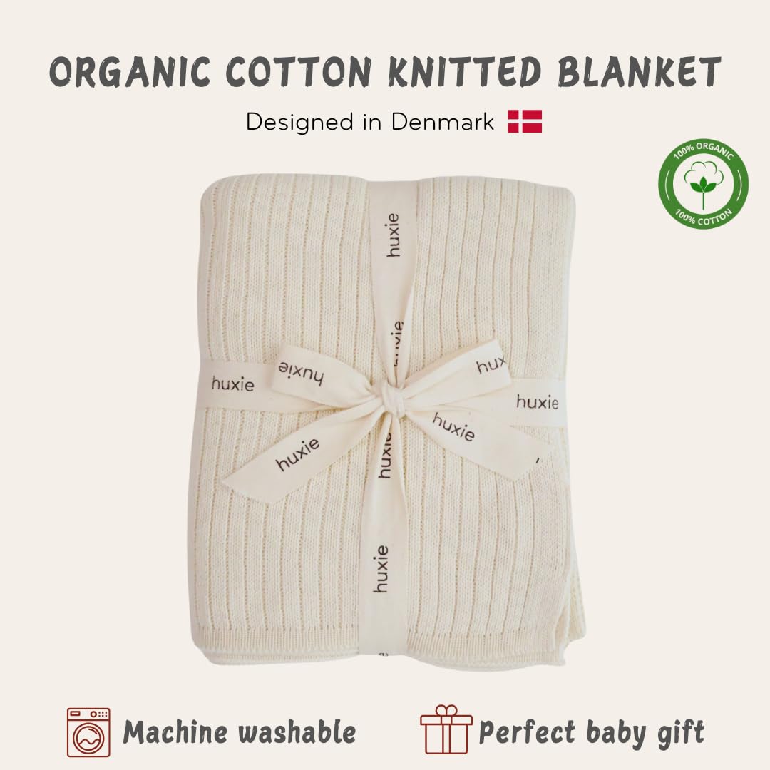 Huxie Knitted Baby Blanket soft white used on stroller for all-season warmth