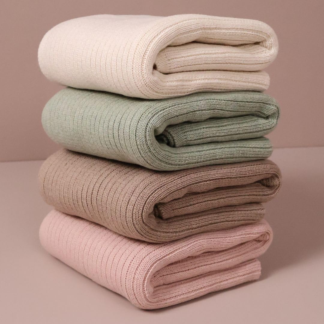 Huxie Knitted Baby Blanket soft white wrapped around baby for cozy coverage