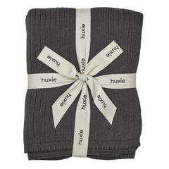 Huxie Knitted Baby Blanket closeup shows ultra-soft organic cotton texture for gentle newborn comfort.
