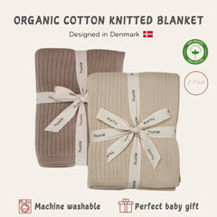 Huxie knitted baby blanket in stroller scene highlights breathable organic cotton.