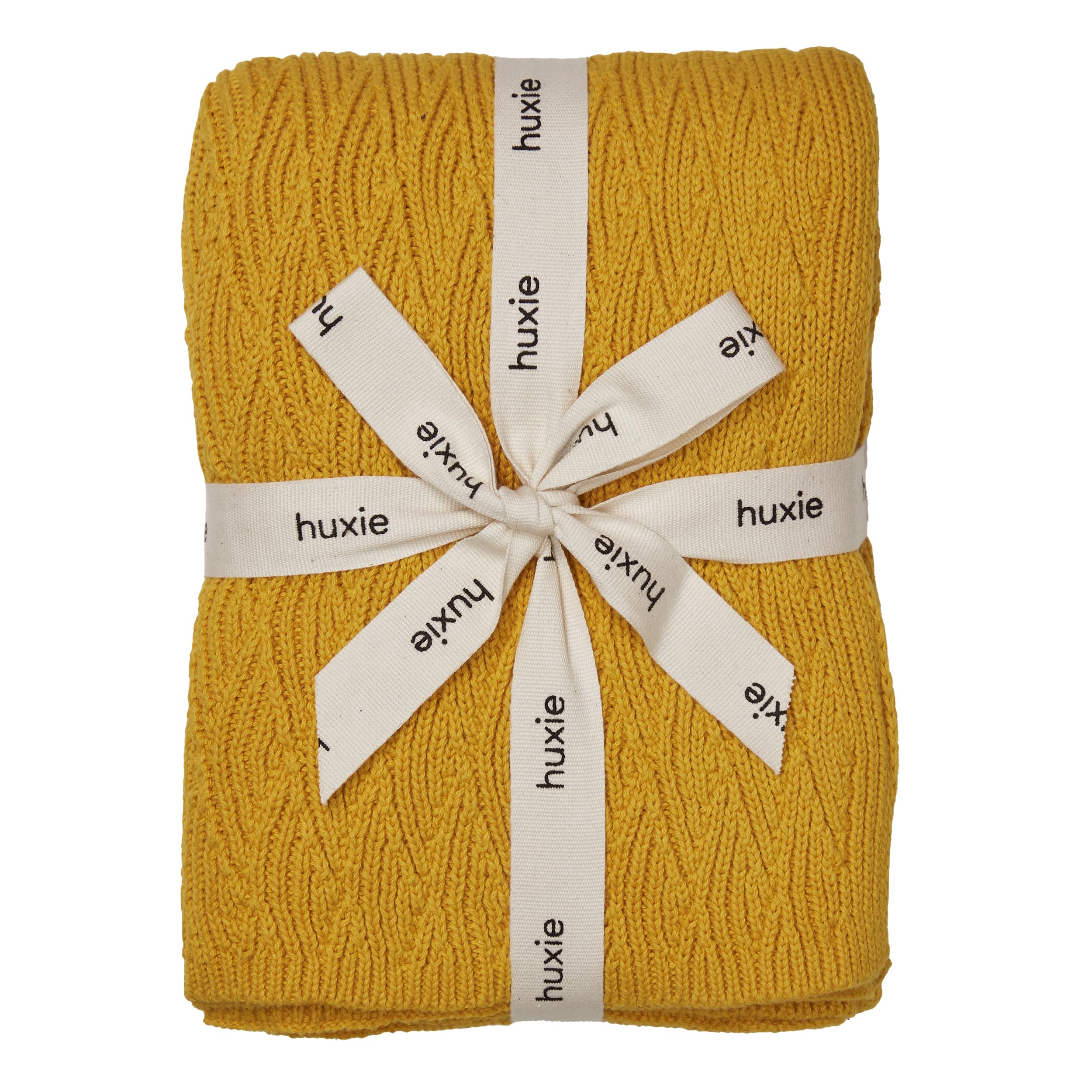 Huxie Waves Yellow knitted blanket closeup showing ultra-soft organic cotton for delicate skin