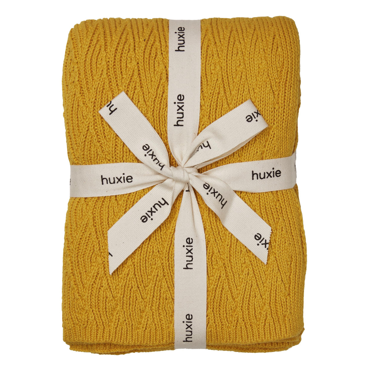 Huxie Waves Yellow knitted blanket closeup showing ultra-soft organic cotton for delicate skin