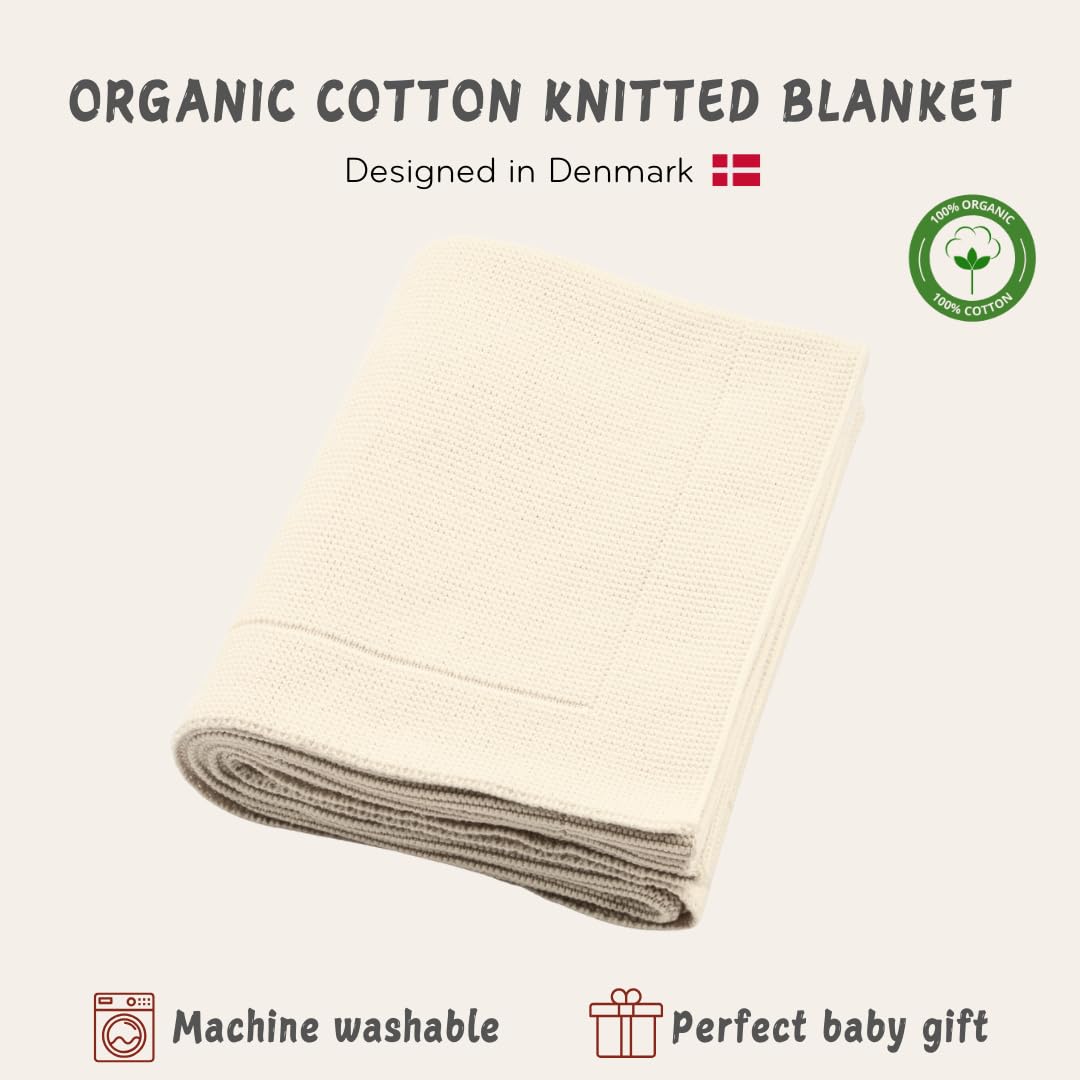 Huxie knitted organic baby blanket close-up emphasizes delicate-skin friendly material.