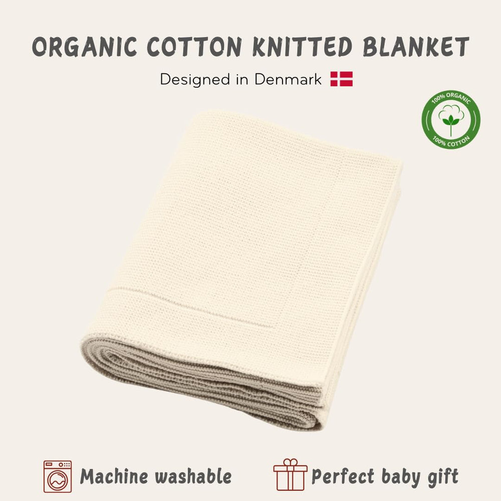 Huxie knitted organic baby blanket close-up emphasizes delicate-skin friendly material.