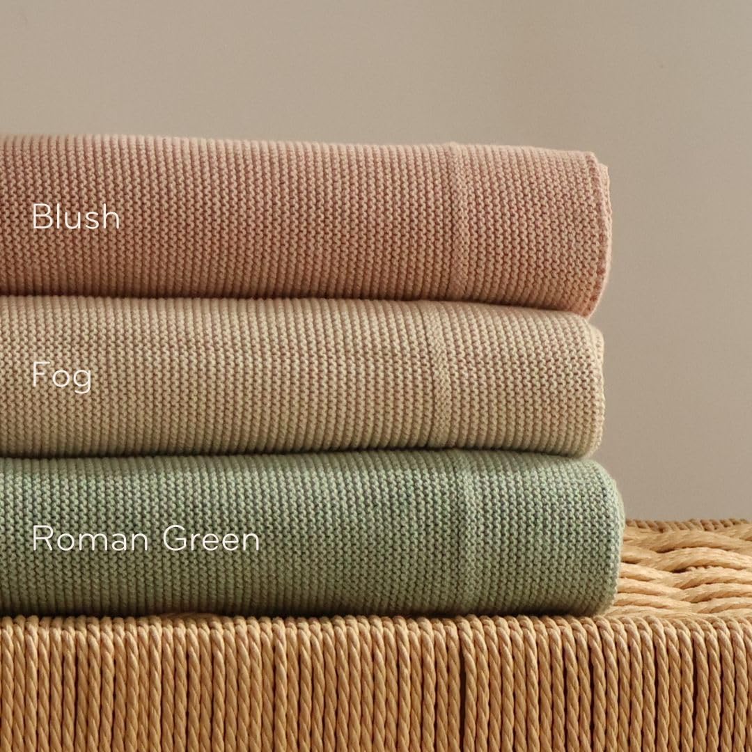 Huxie knitted organic baby blanket makes a timeless gift with soft, gender-neutral charm.