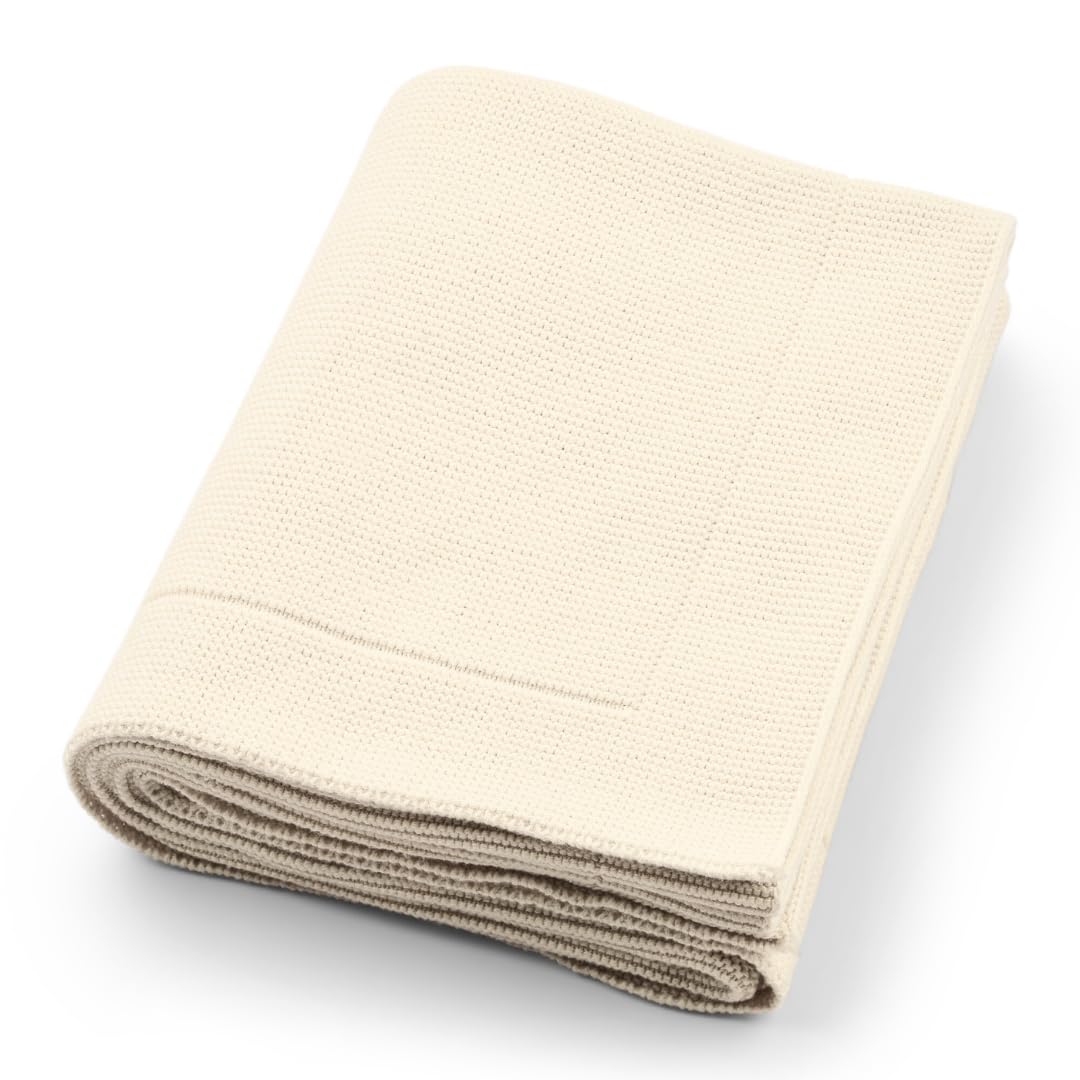 Huxie knitted organic baby blanket close-up shows ultra-soft cotton for sensitive skin.