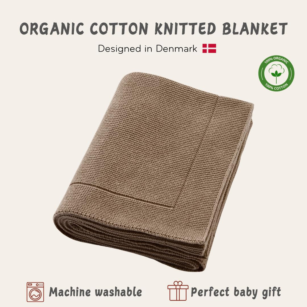 Huxie knitted organic cotton baby blanket swaddle demonstrates cozy wrap for naps