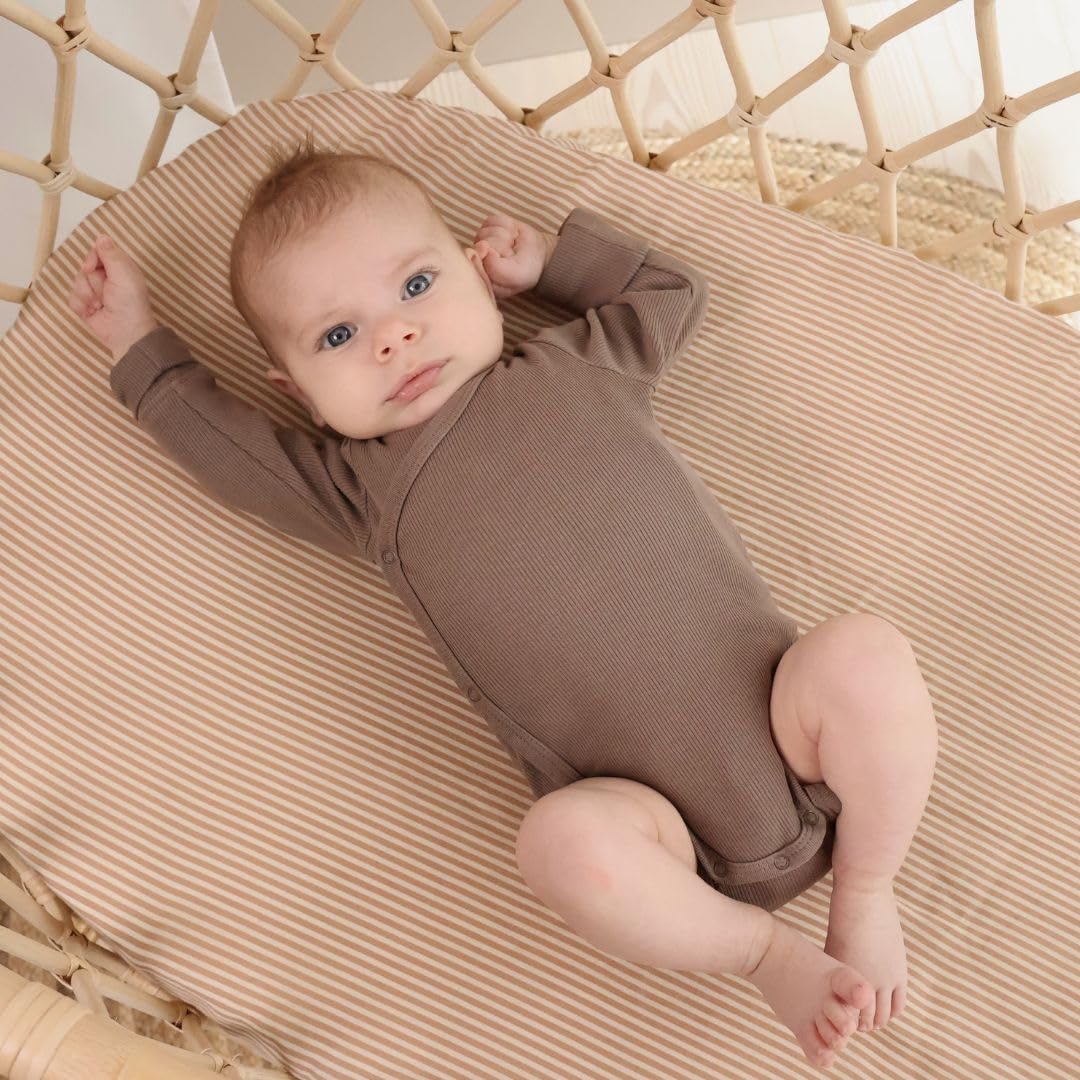 Huxie mini crib sheet 24x38 fit highlights deep pockets and elastic edge for a secure, snug fit.