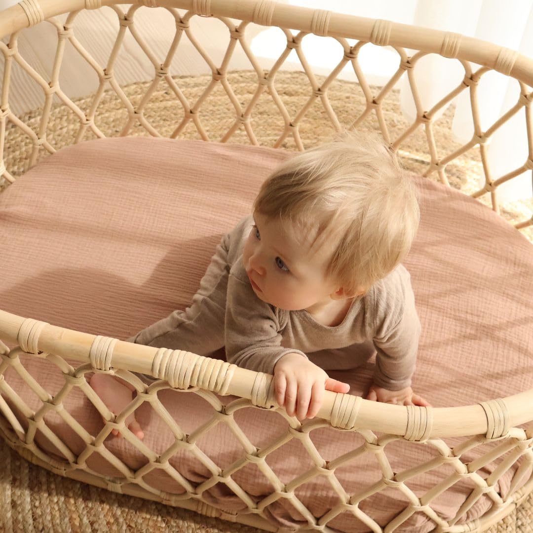 Huxie mini crib sheet on Pack and Play demonstrates secure fit for travel