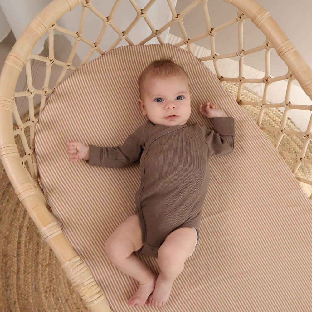 Huxie mini crib sheet gender-neutral natural stripe complements any nursery and makes a thoughtful gift option.