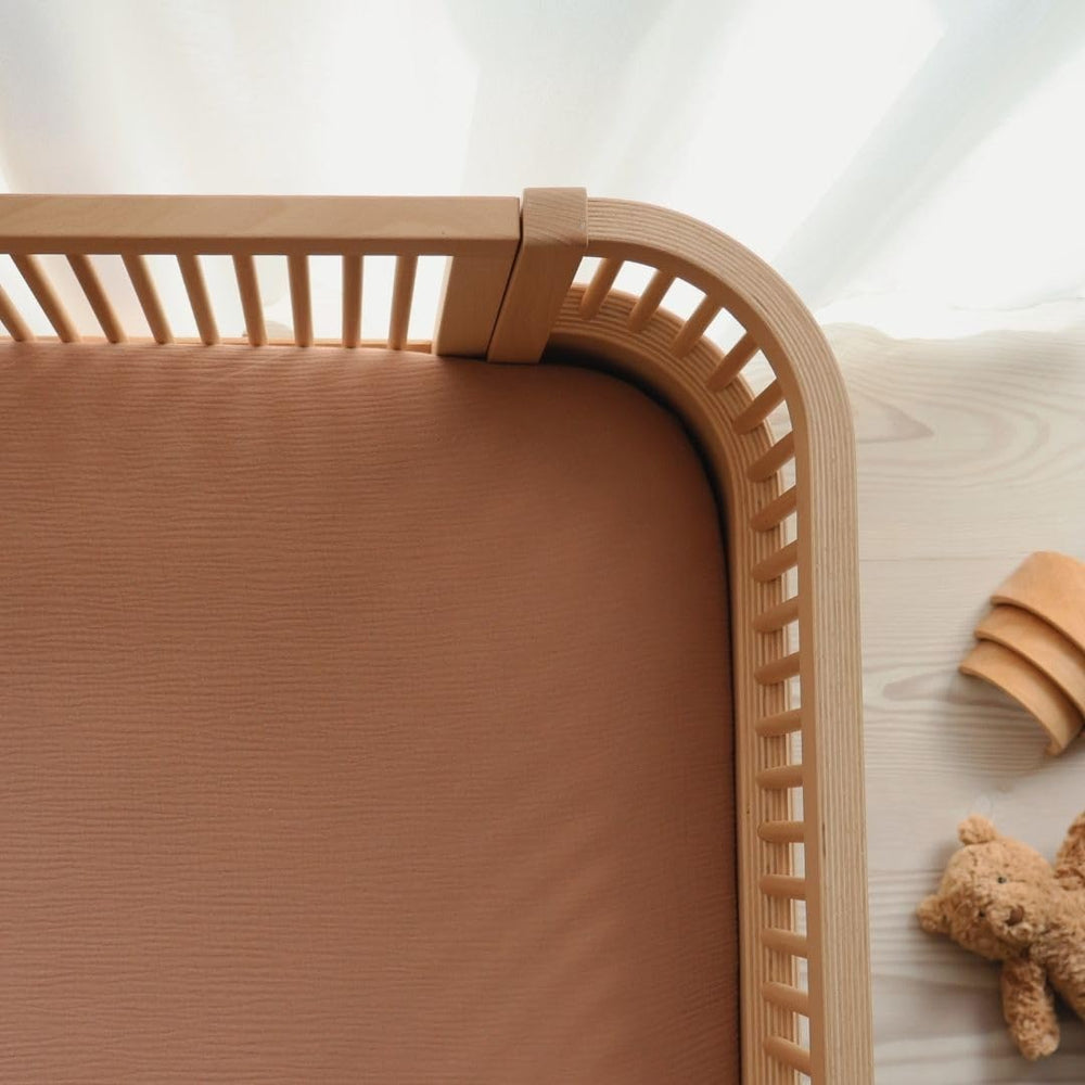 Huxie mini-crib-sheet secure-fit deep pockets ensure reliable placement