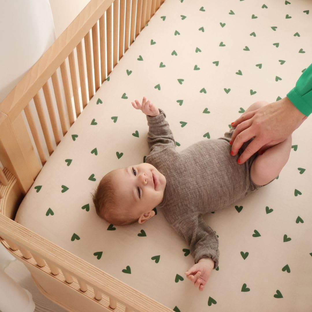 Huxie organic cotton muslin material zoomed in emphasizing breathable touch.
