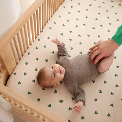 Huxie organic cotton muslin material zoomed in emphasizing breathable touch.