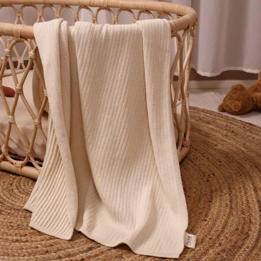 Huxie care label view communicates simple cold-wash tumble-dry routine.