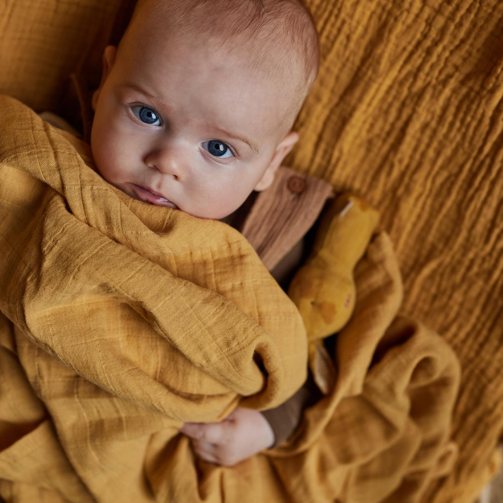 Huxie Swaddle Autumn Yellow multi-use blanket for nursing and shade