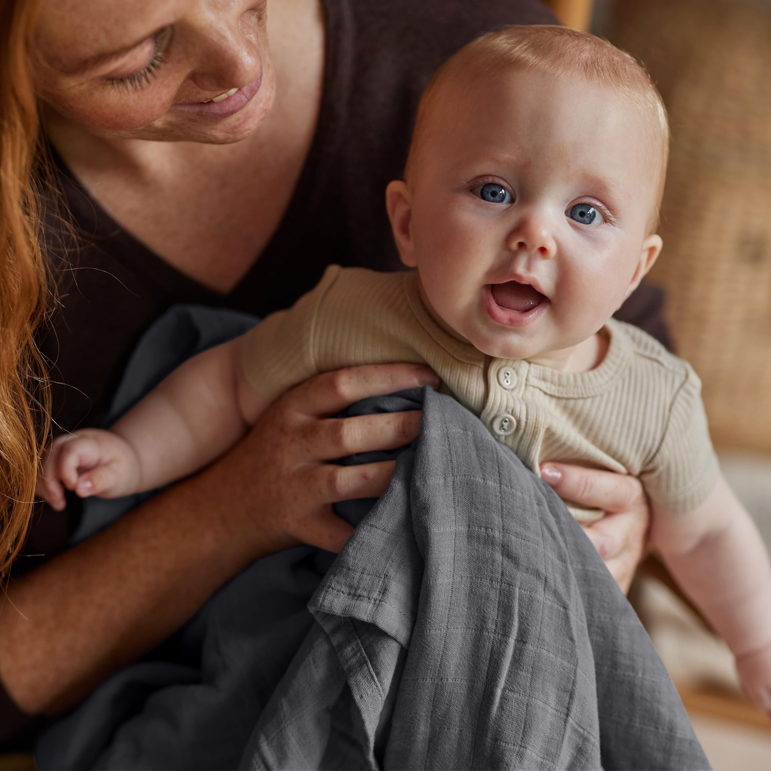 Huxie Swaddle baby-care scene with stroller sunshade demonstrates shade and protection.