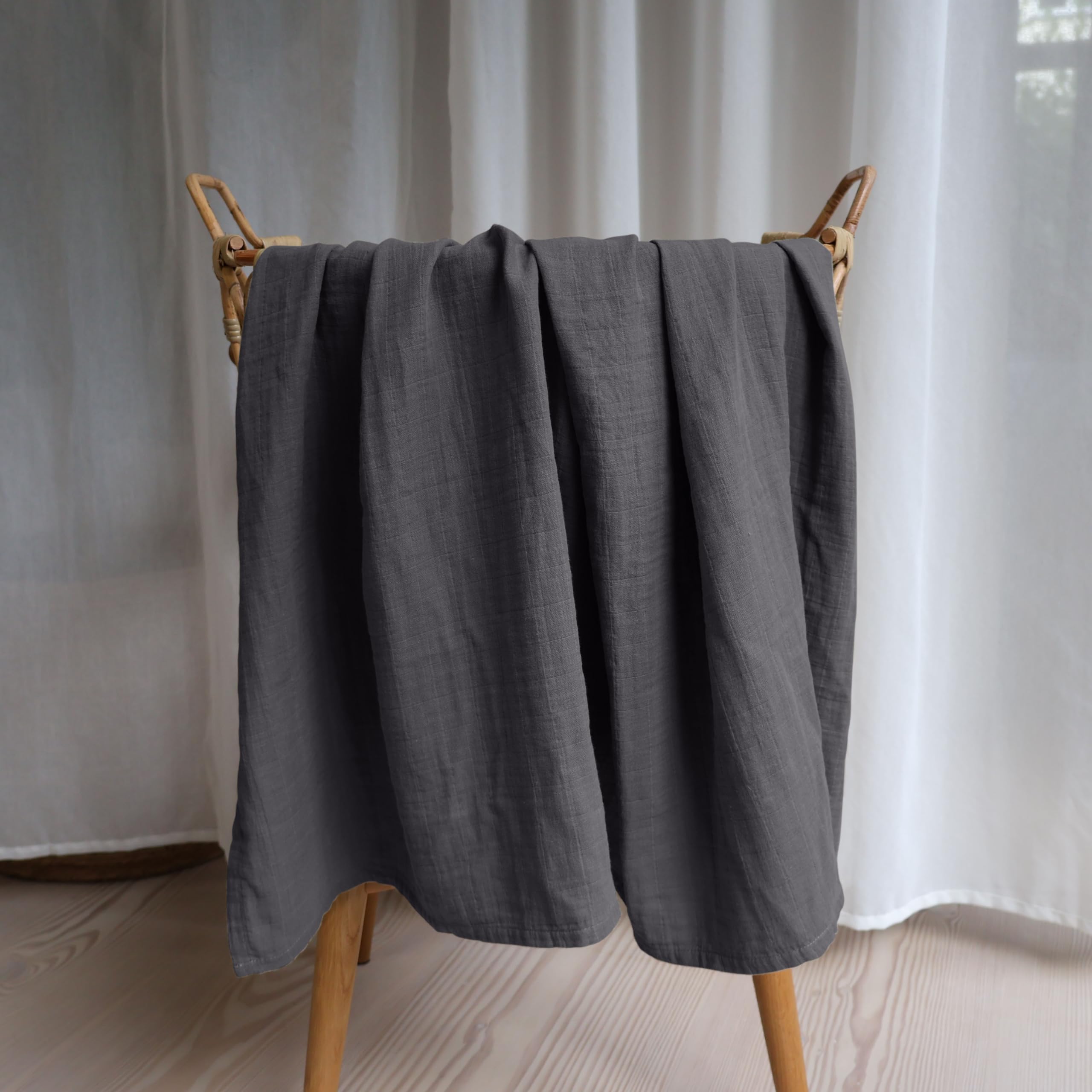 Huxie Swaddle organic-cotton closeup emphasizes 100% organic material and softness.