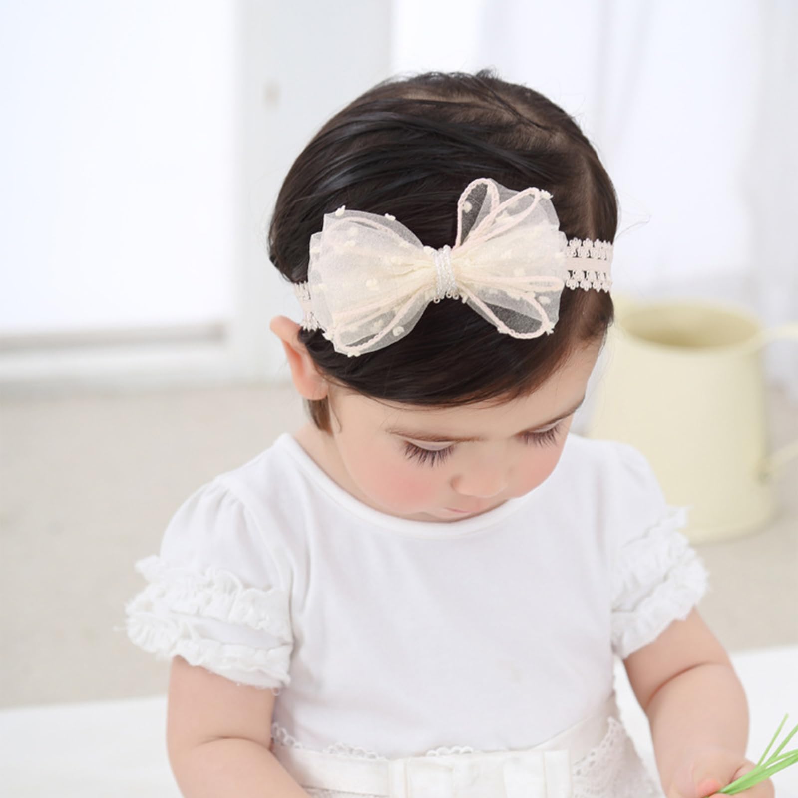 ickeyou baby bow headband worn on infant for cute photos.