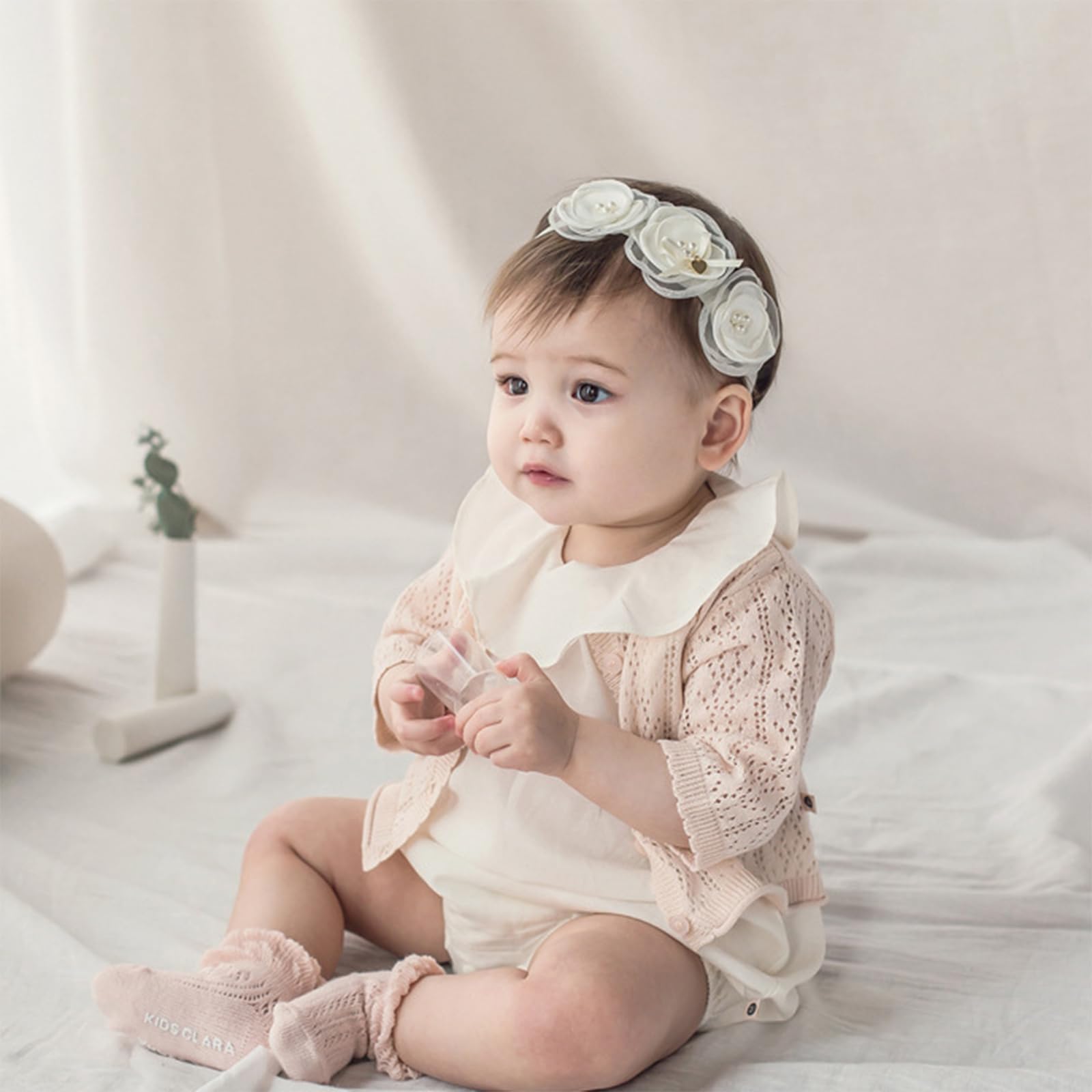 ICKEYOU daisy accents headband complements christenings and birthday outfits.