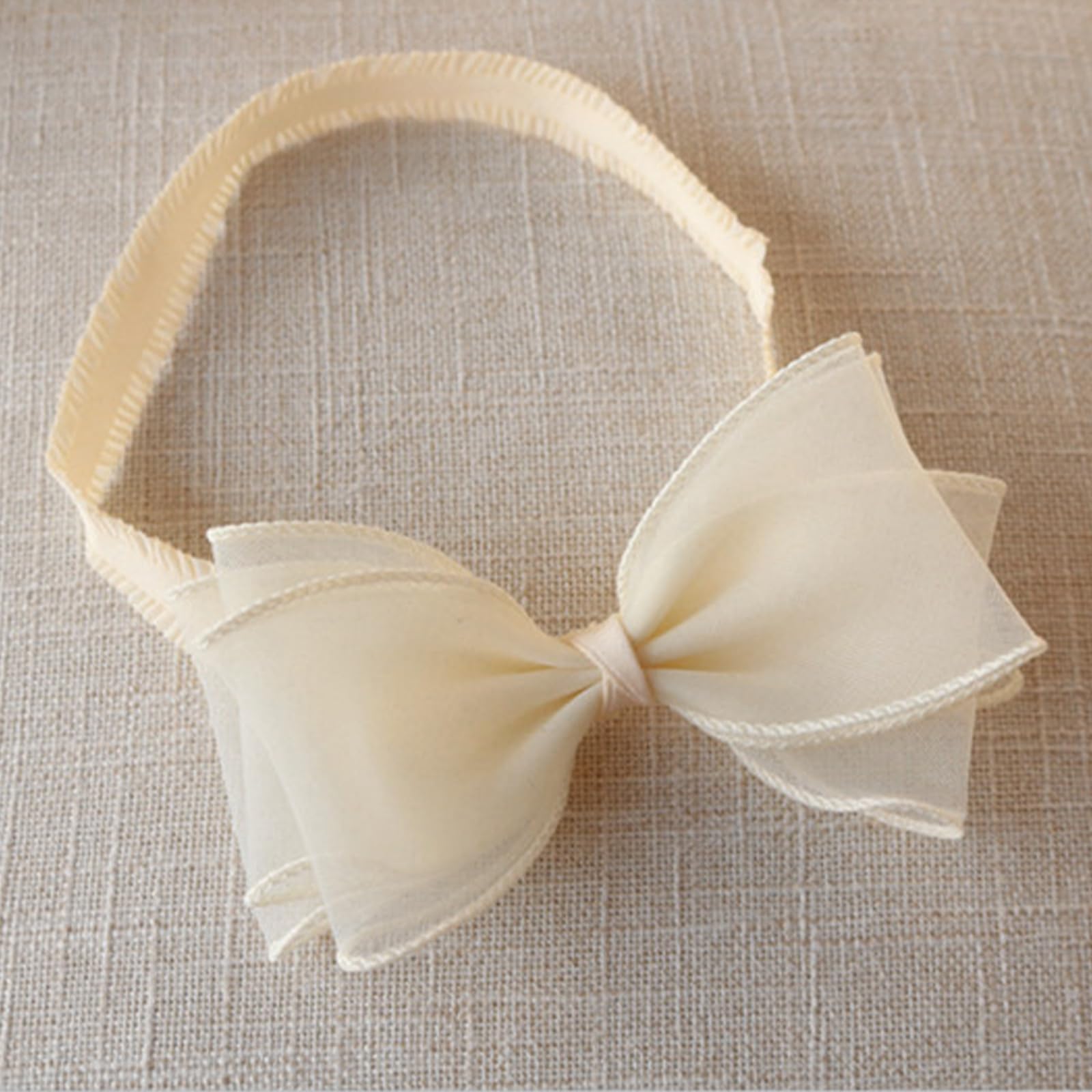 ICKEYOU handmade cotton headband with delicate details and color variations.