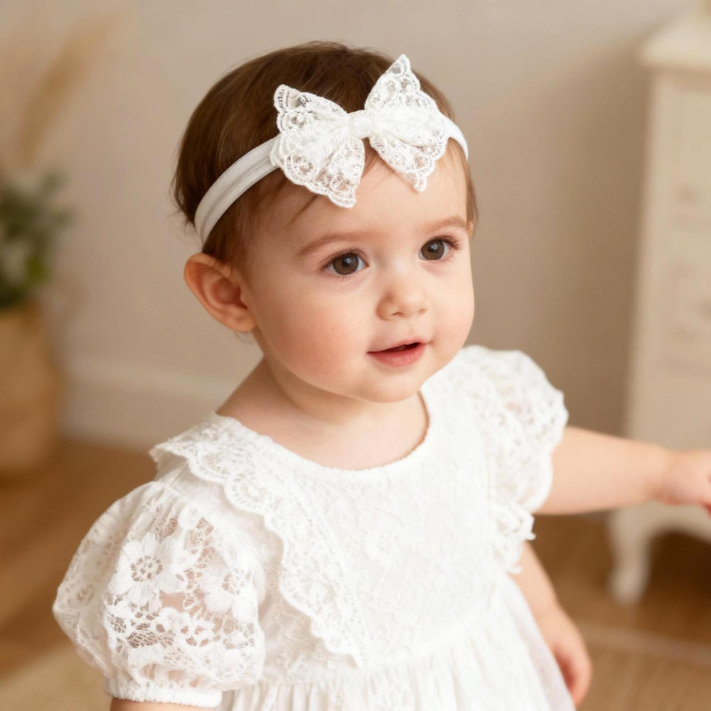 ICKEYOU lace bow headband on toddler demonstrates adjustable fit without leaving marks