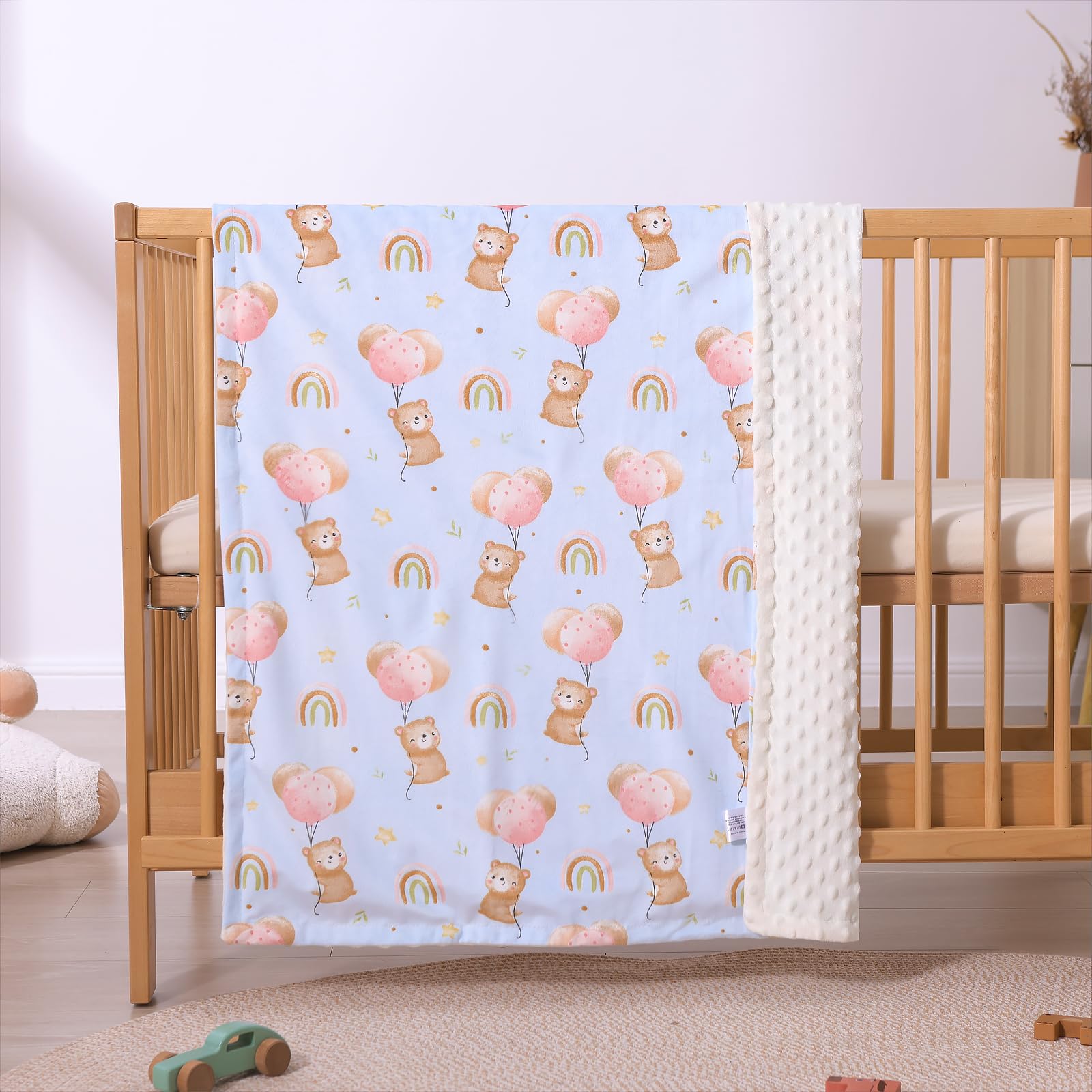 iEvolve blanket shown as stroller or car-seat cover for on-the-go use.