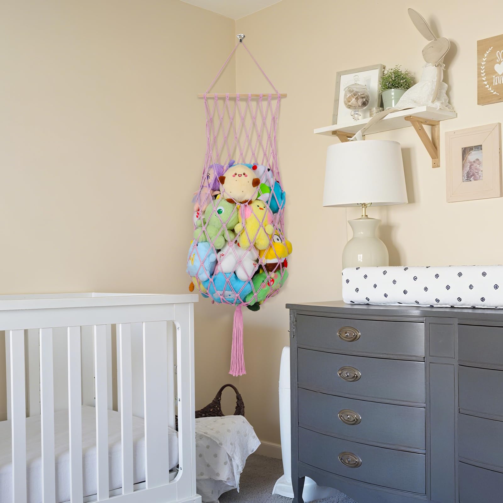 iHansee light pink toy hammock setup in a corner enhances room decor.