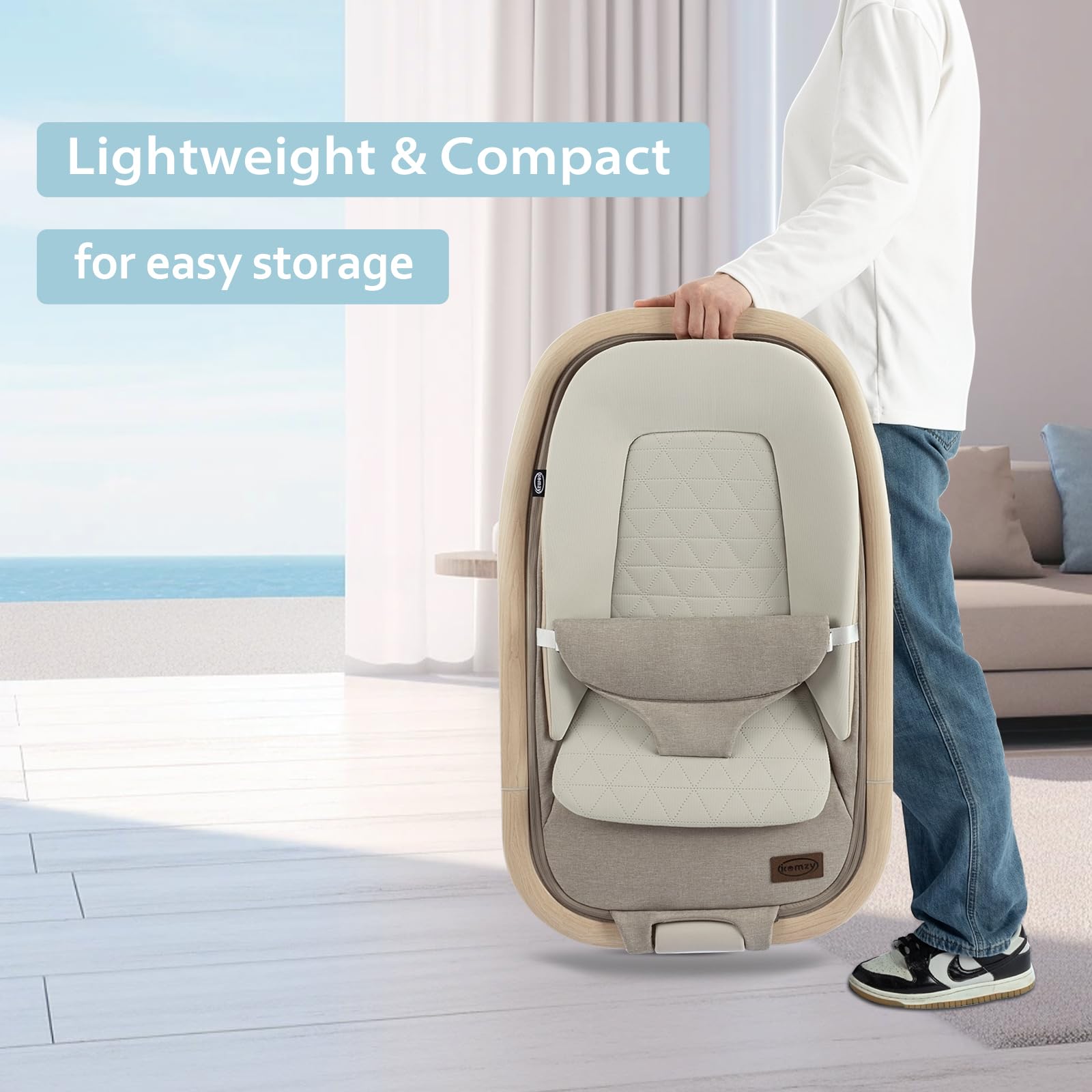 IKOMZY Noah bouncer includes hanging toys to stimulate early senses.